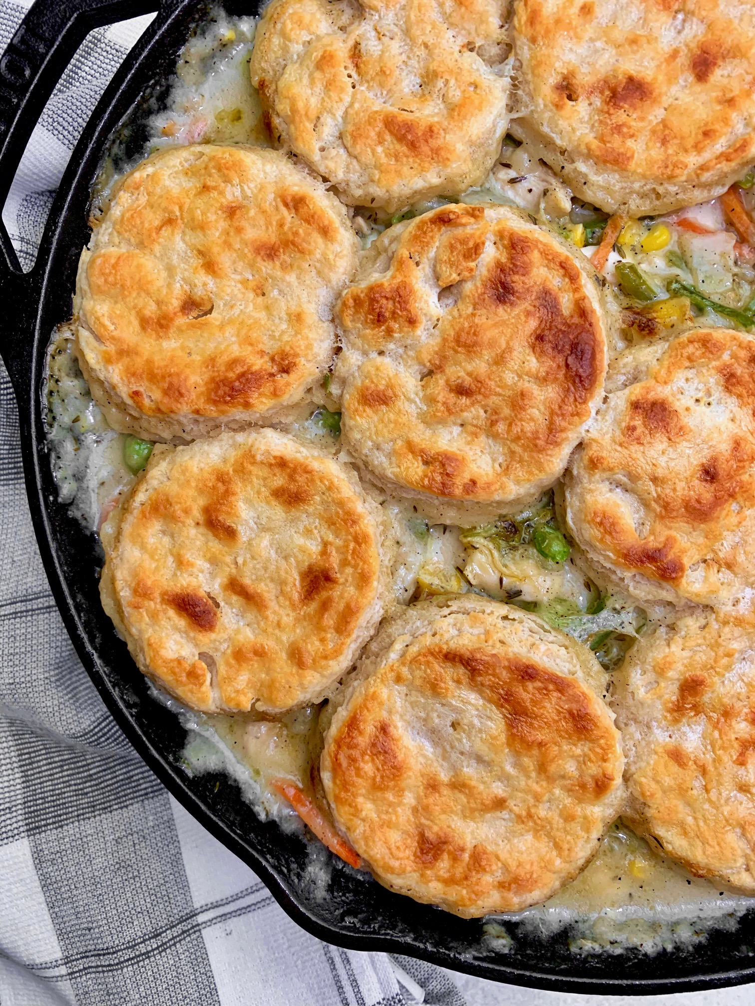 A close up of the finished chicken pot pie with buttermilk biscuits on top.