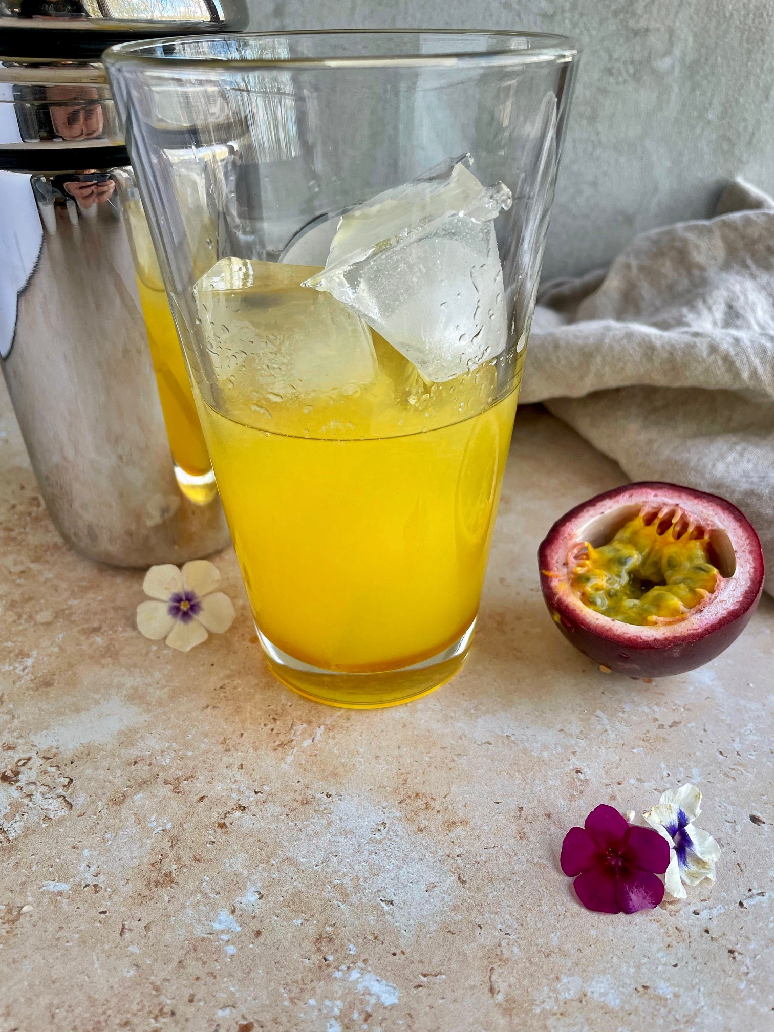 the honey, lemon juice, passion fruit juice and liquor in a pint glass with ice before shaking in cocktail shaker.