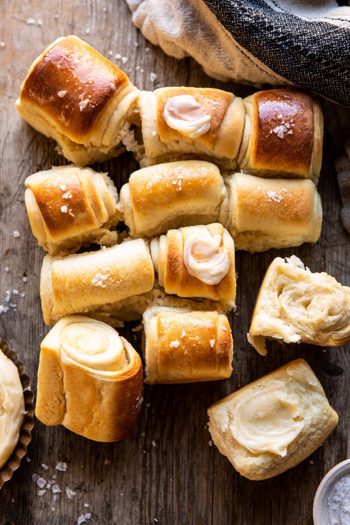 parker house rolls on a cutting board.