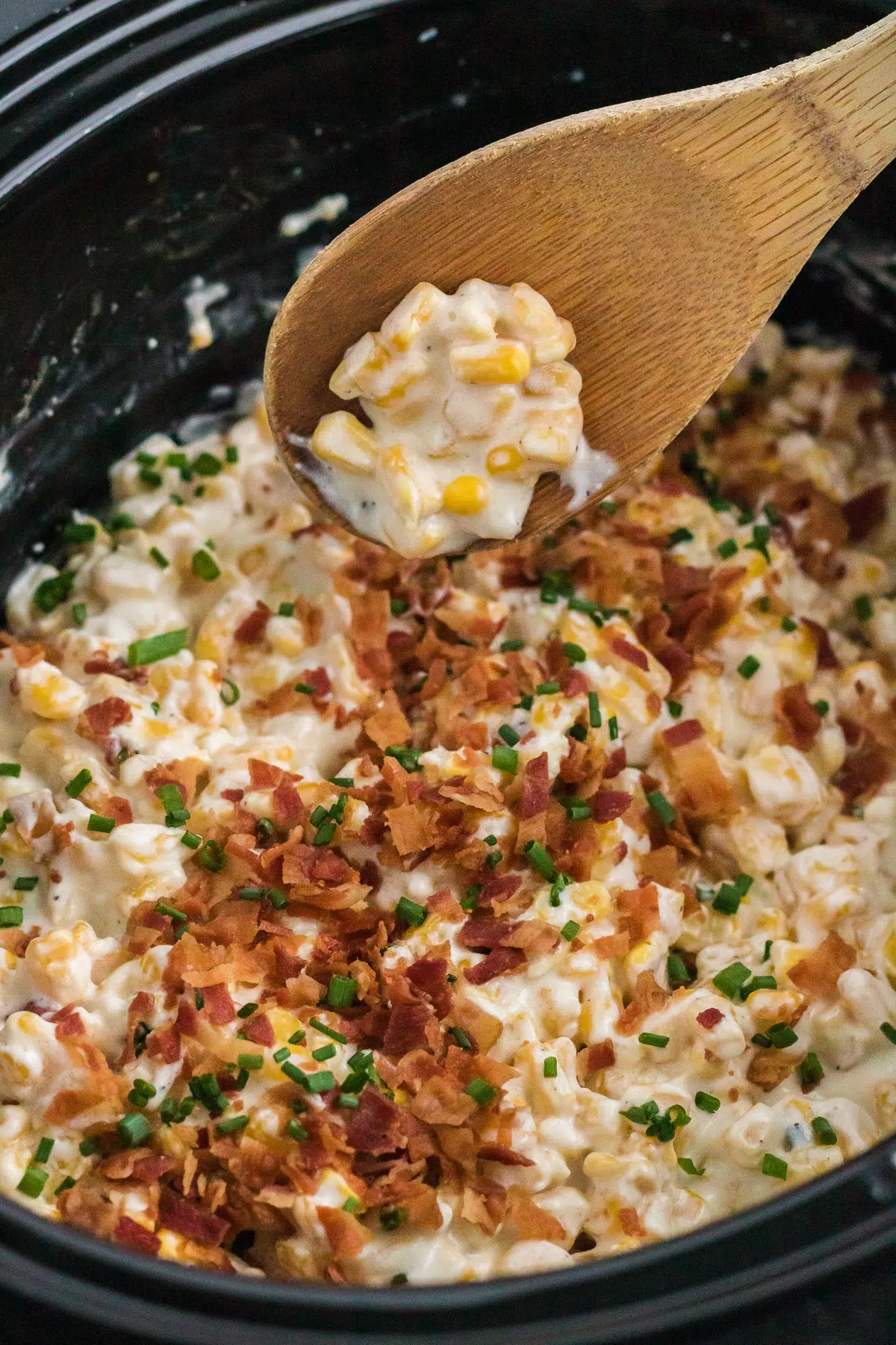 slow cooker creamed corn topped with bacon.