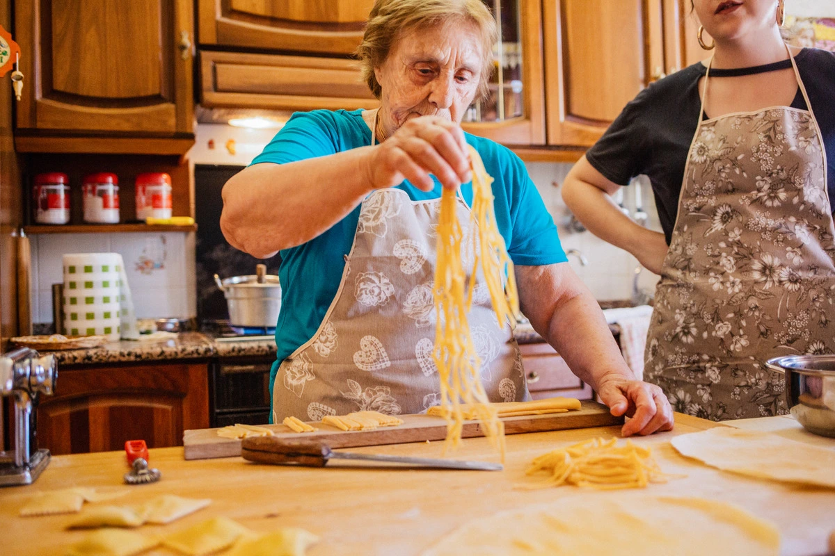Picture of Italian grandma making fresh pasta.