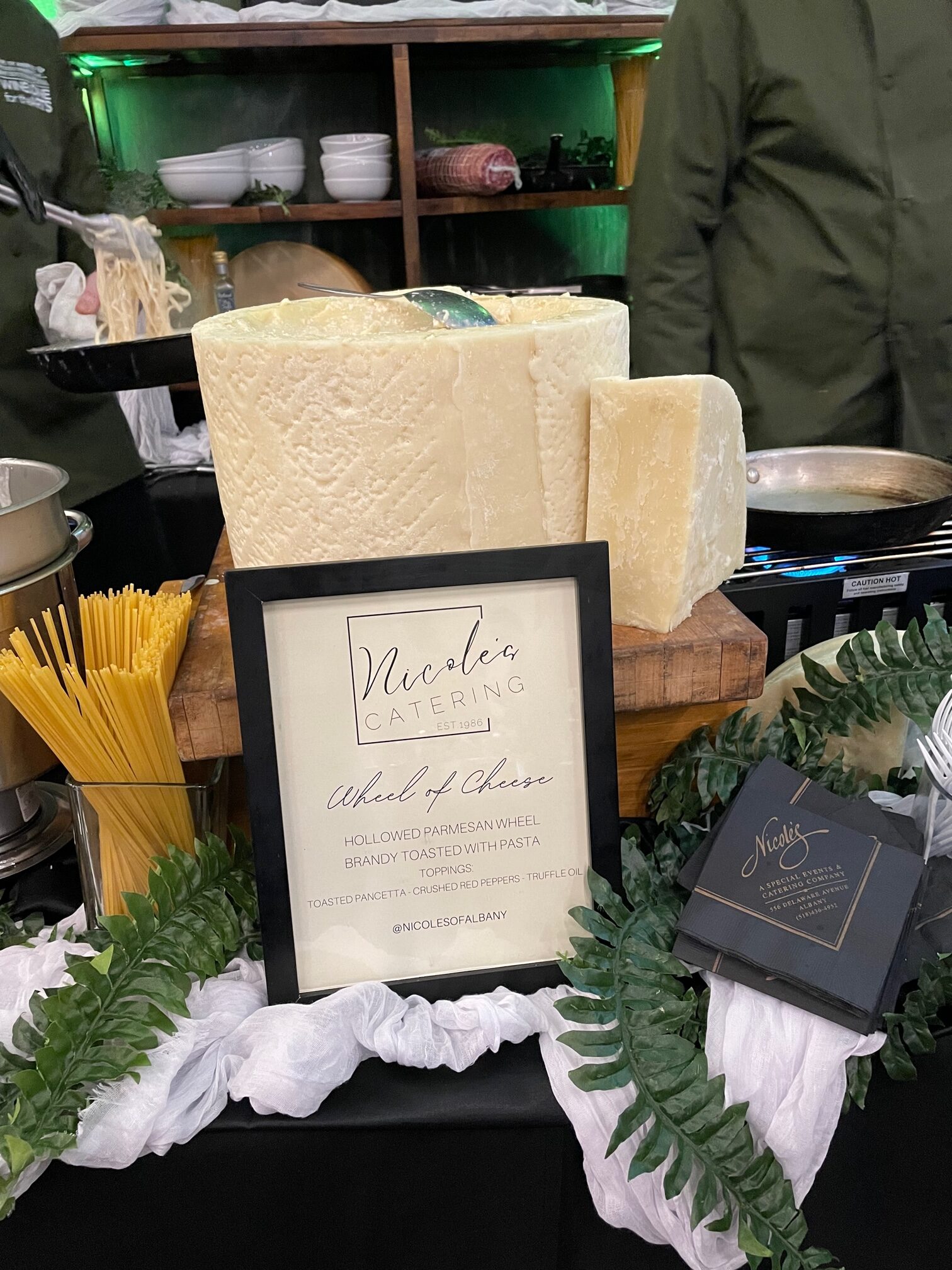 Giant parmesan cheese wheel at Nicole's station at the 2023 Albany Chef's Food and Wine Festival.