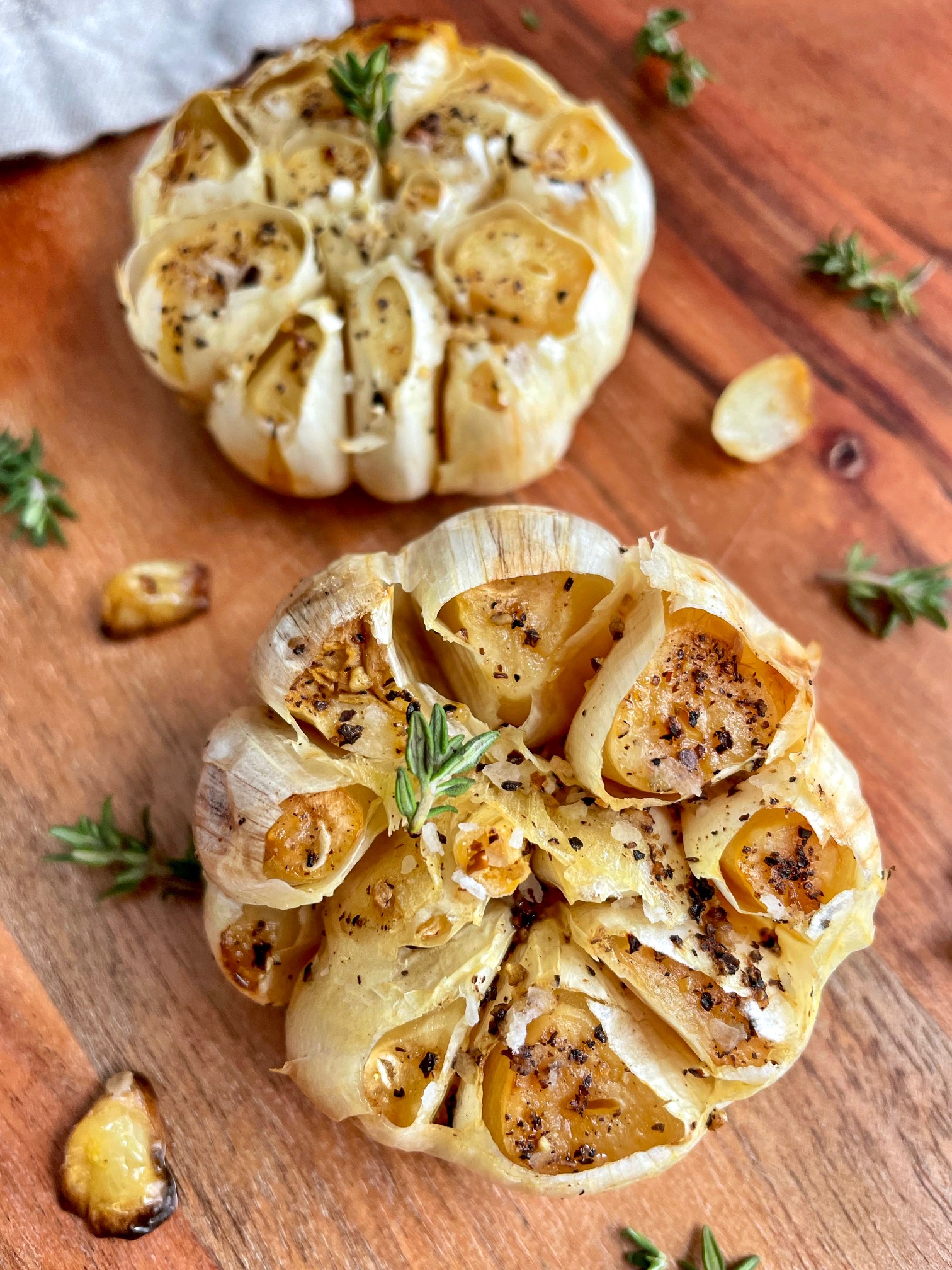 Two heads of air fryer roasted garlic.