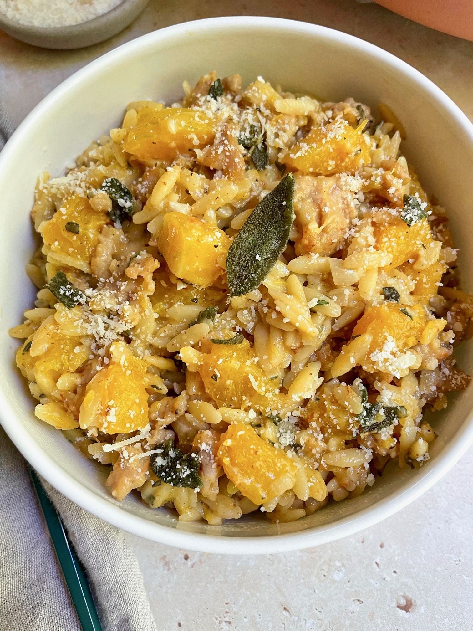 The butternut squash sausage orzo in a bowl.