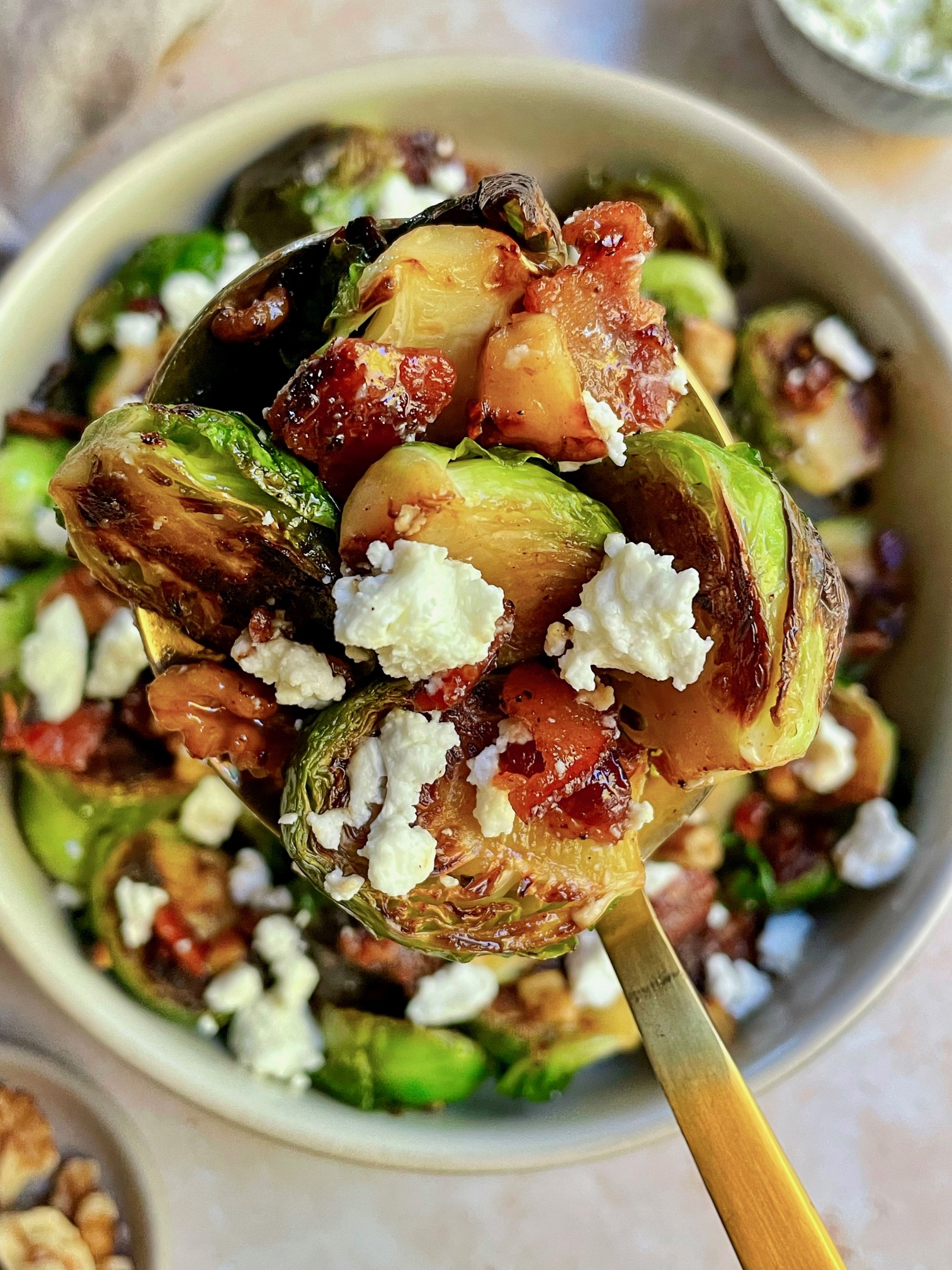 Maple bacon Brussels sprouts on a spoon.