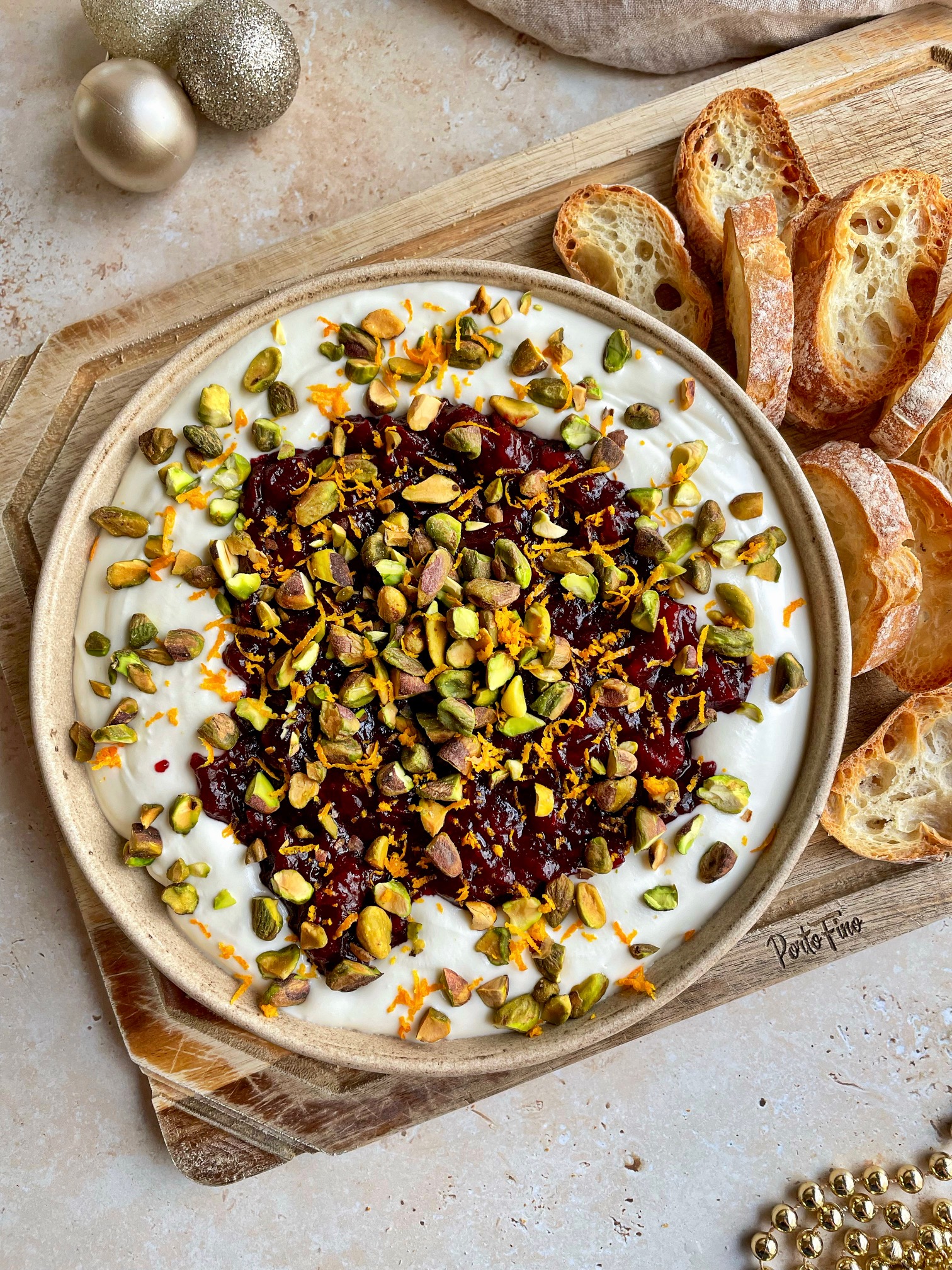 An overhead shot of the dip with toasted baguette next to it.