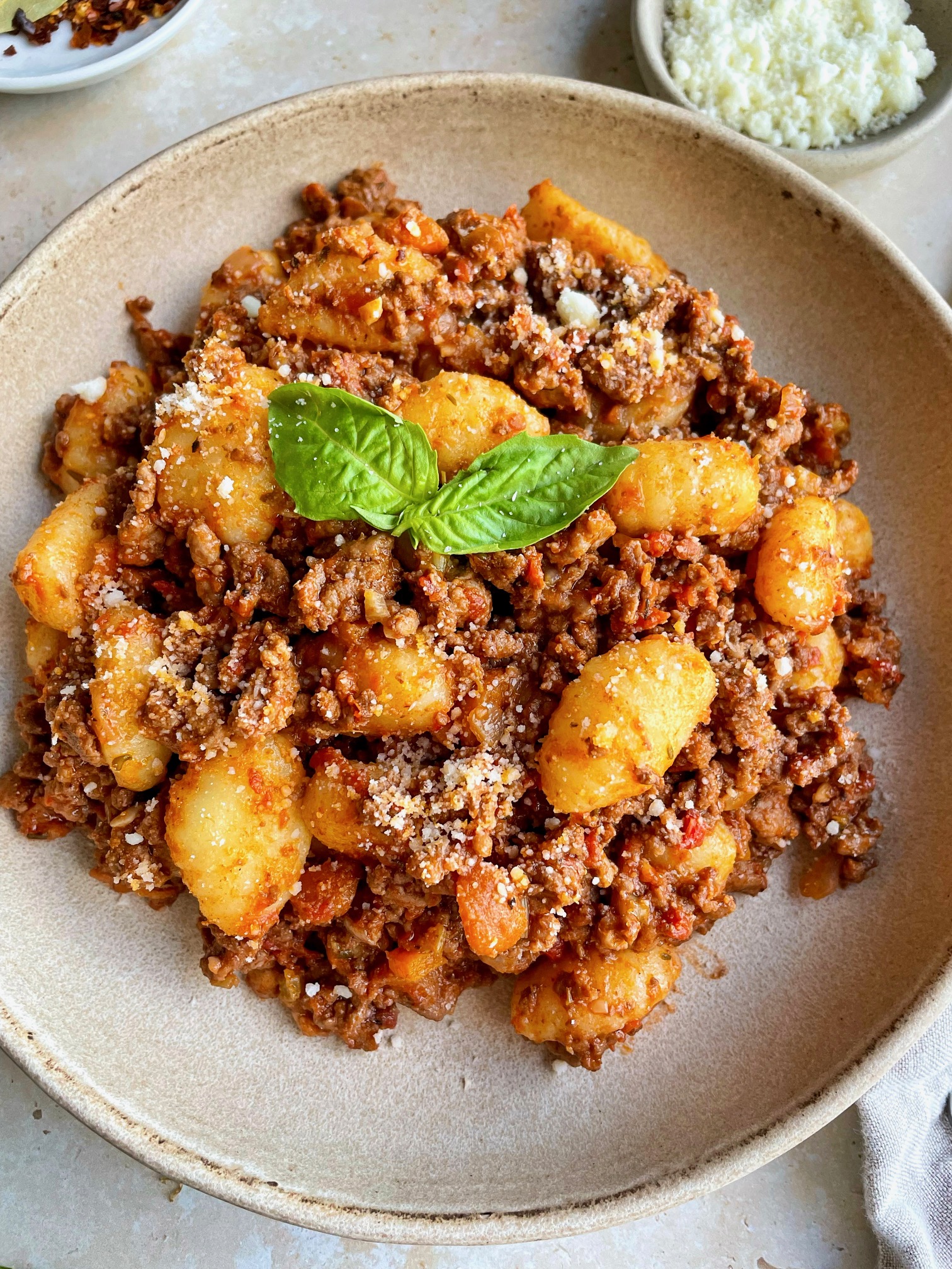 A close up of the gnocchi bolognese in a bowl.