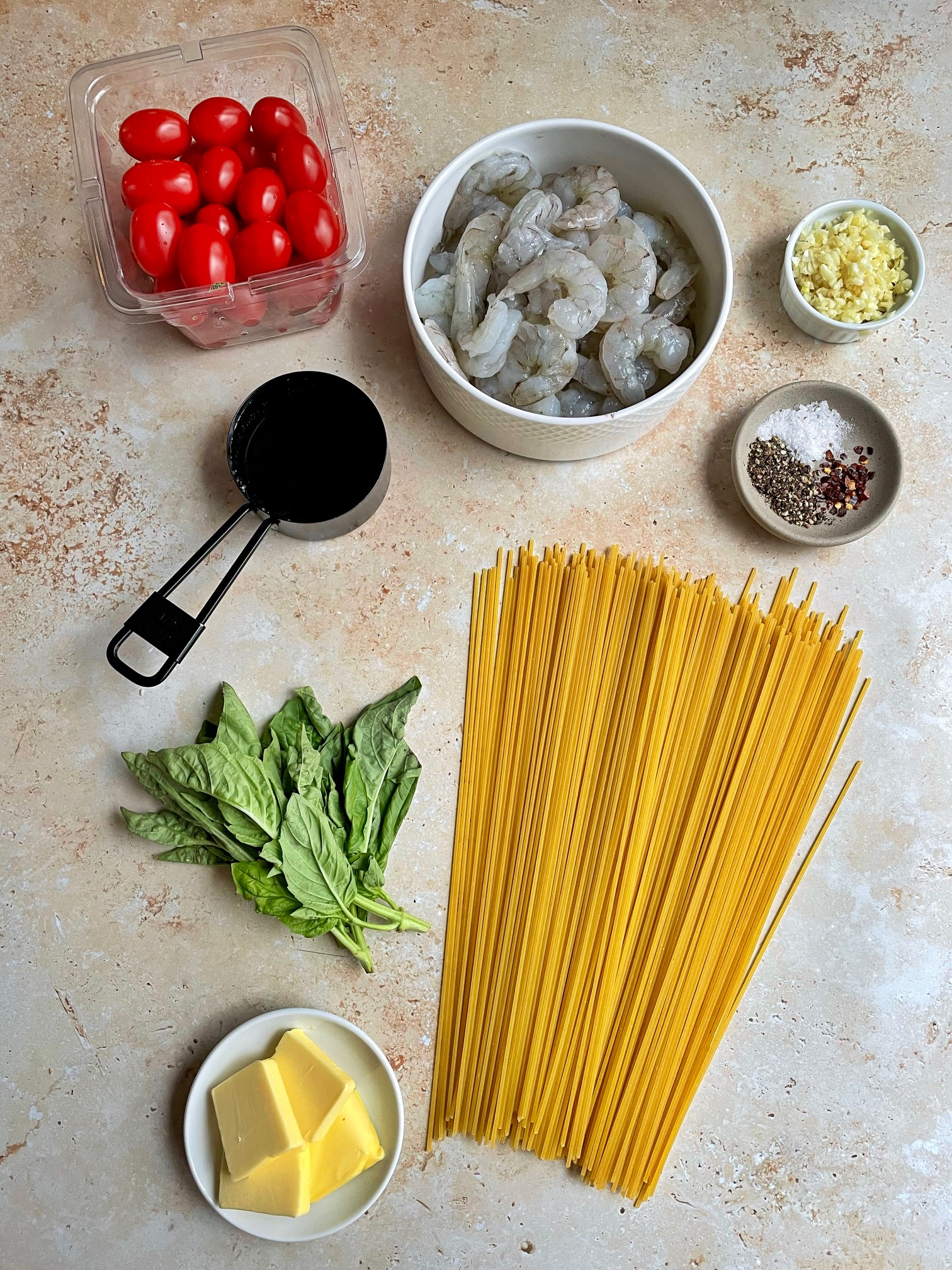 The ingredients to make tomato basil pasta with shrimp.