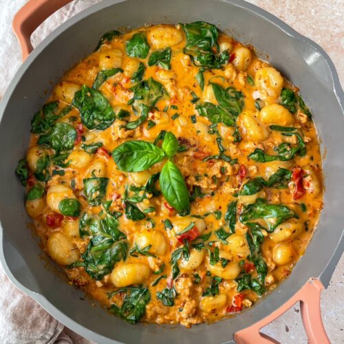 An overhead shot of a pan of marry me sausage and gnocchi.