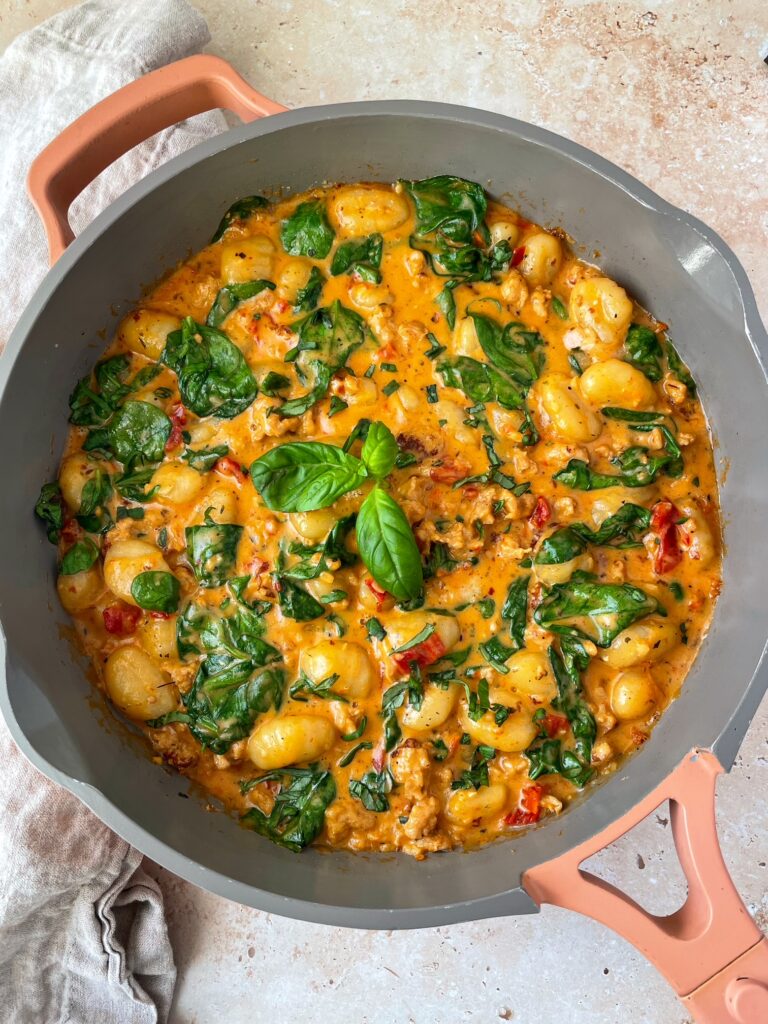 An overhead shot of a pan of marry me sausage and gnocchi.