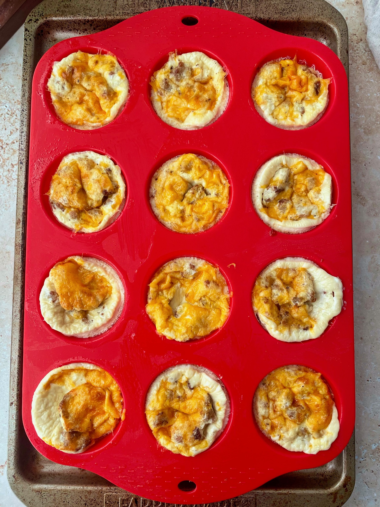 The baked egg white bites in the muffin tin.