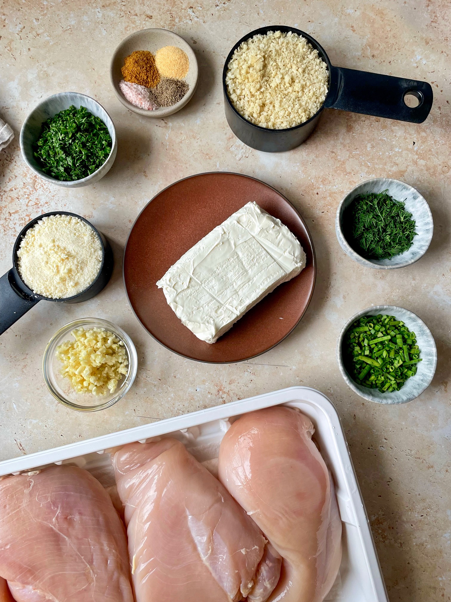 The ingredients to make garlic herb stuffed chicken.