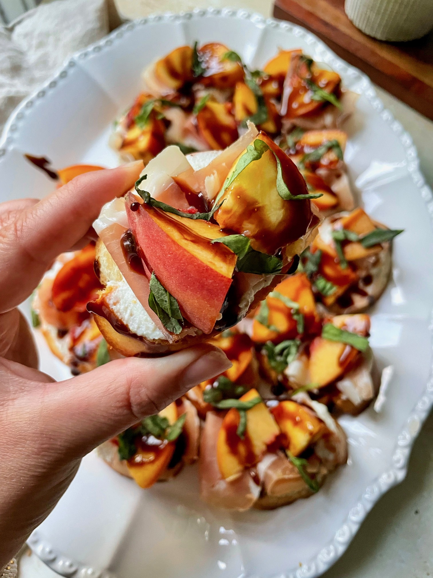A close up shot of a crostini to show the text and ingredients.