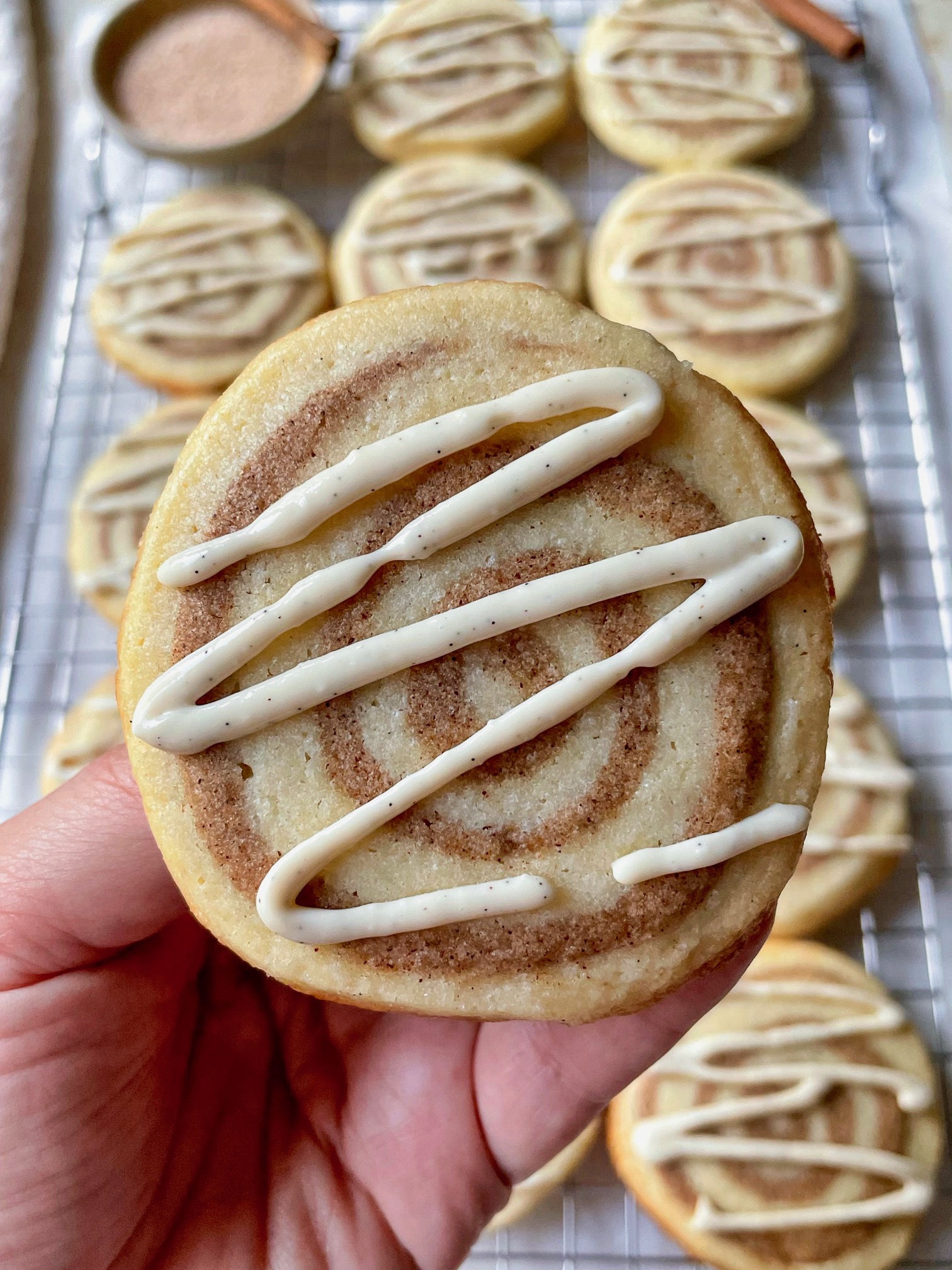 A close up shot of cinnamon roll sugar cookies to show texture.