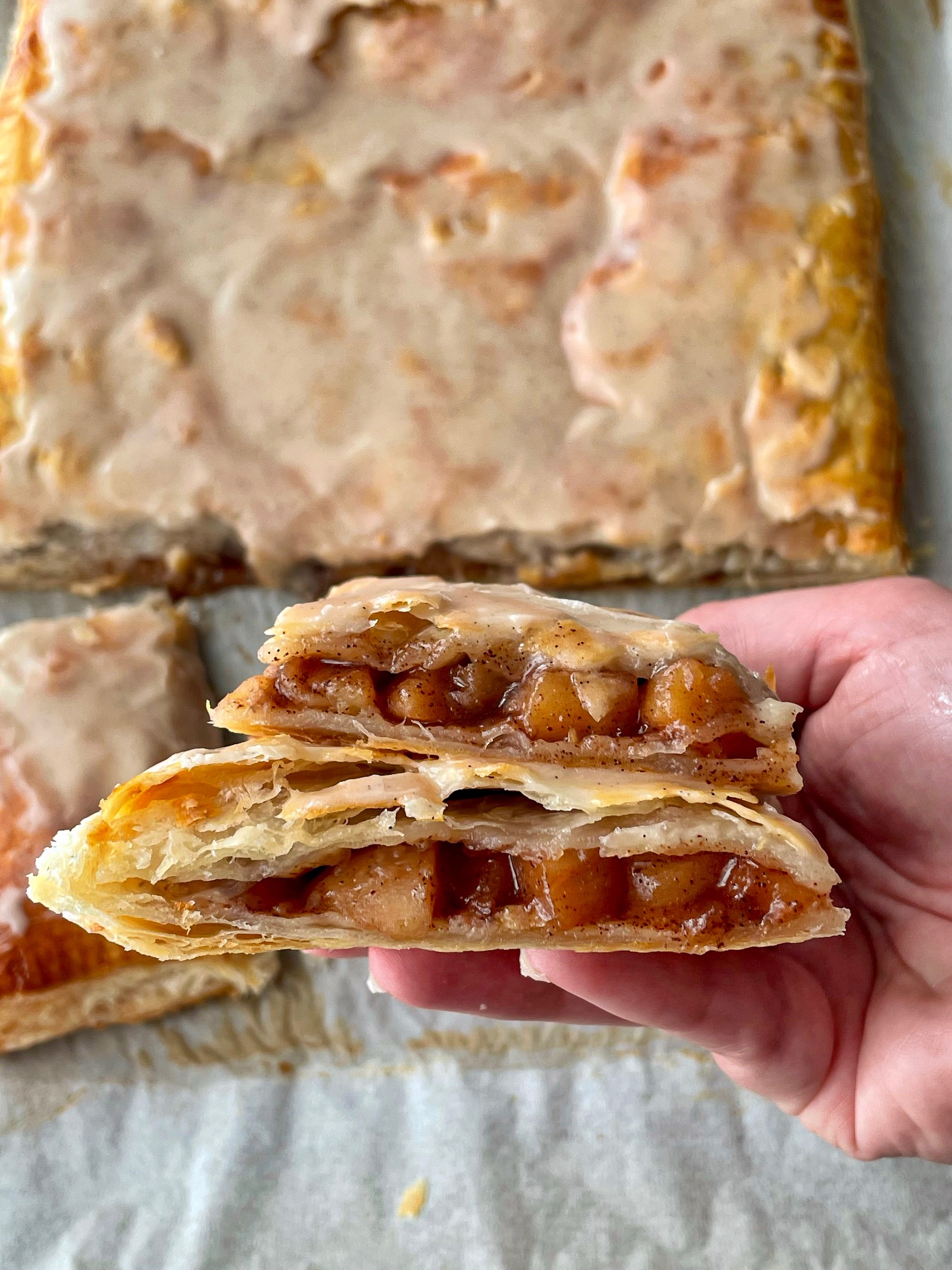 An up close shot of the strudel cross section to show the inside filling and flaky layers.