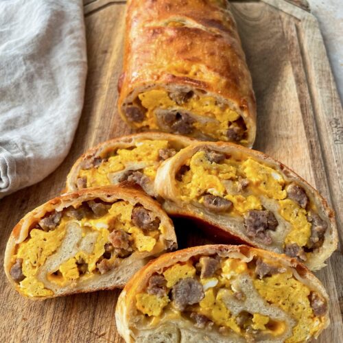 Slices of breakfast garbage bread displayed on a cutting board.
