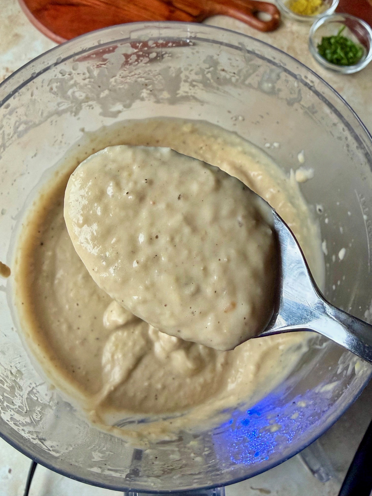 The dip on a spoon after blending.
