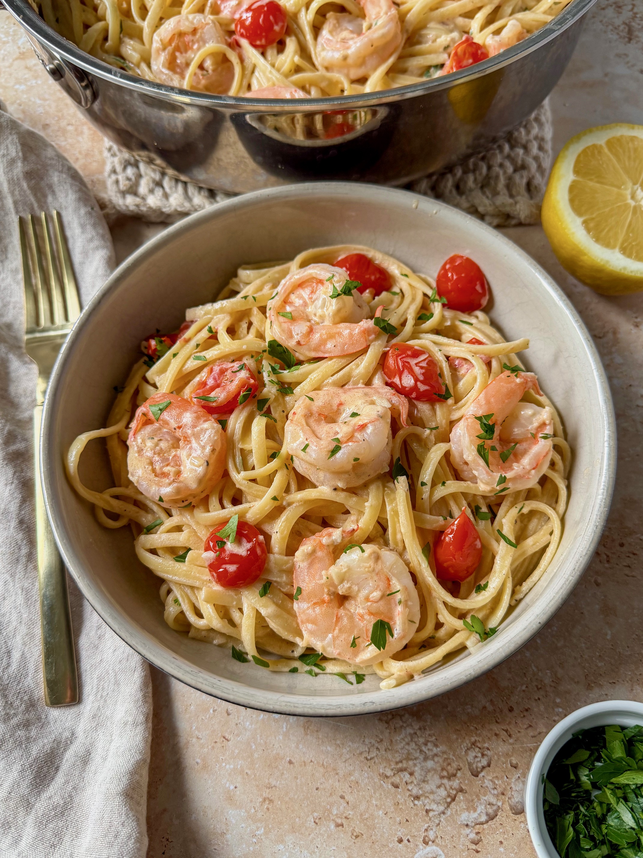 A bowl of creamy lemon garlic shrimp pasta.