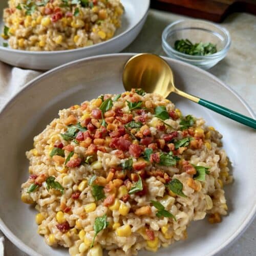 Two bowls of sweet corn and mascarpone risotto.